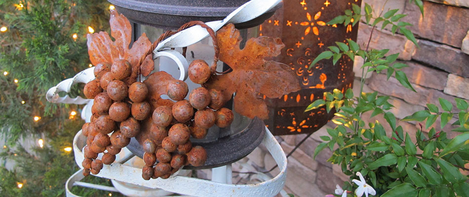 Rusted Metal Grape Bunches hang on a Trellis at Tanis Vineyards Winery in Amador County, California.