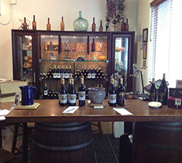 Behind the tasting bar at Tanis Vineyards Winery.