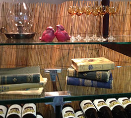 Antique love bird figurines and books. Antique amber glass cordial glasses.